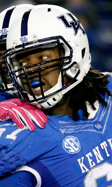 WATCH: 300-pound UK defensive lineman rumbles 77 yards for TD